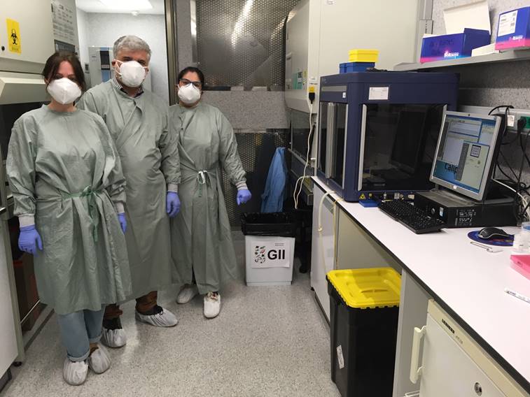 Volunteers Leonor Ávila, Carlo Carolis and Anna Puig finishing the first set of RNA isolations successfully on 19th April.